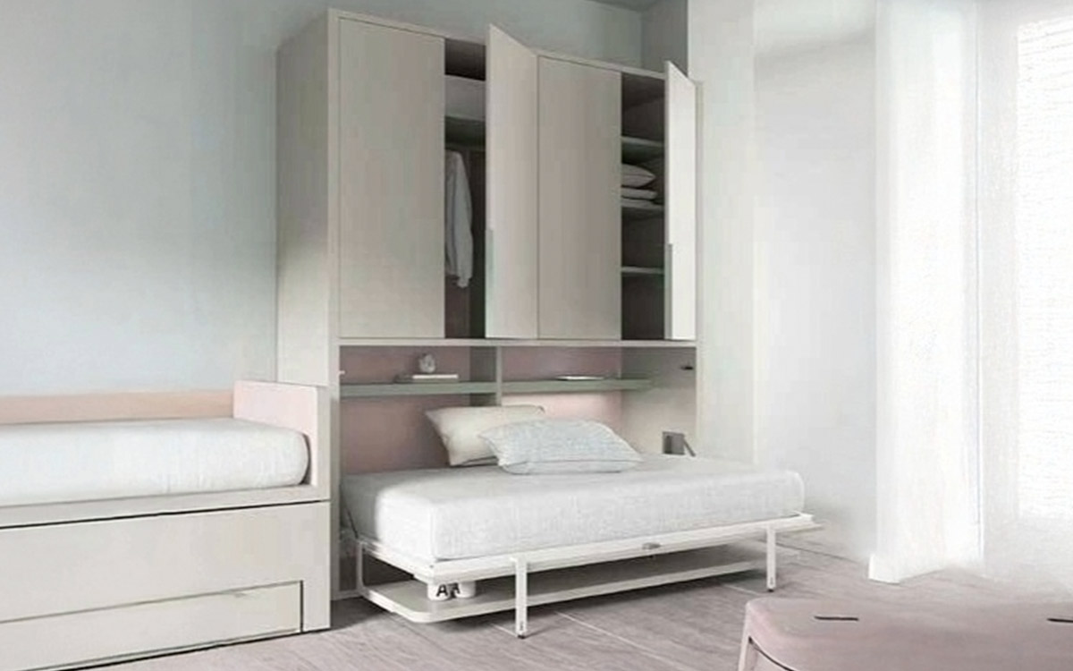 Cama abatible horizontal individual con altillo y mesa de estudio integrada.