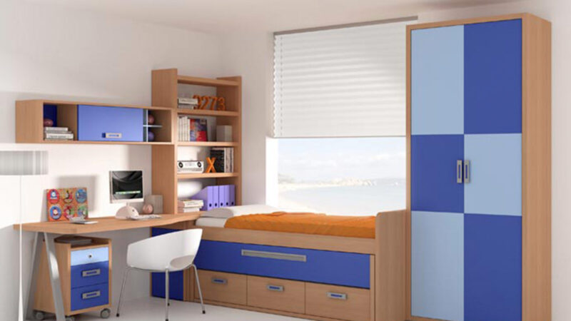 Dormitorio juvenil con cama nido elevada, somier extraíble y cajones inferiores, escritorio alargado con librería y módulo de almacenamiento, acabado en chapa sintética