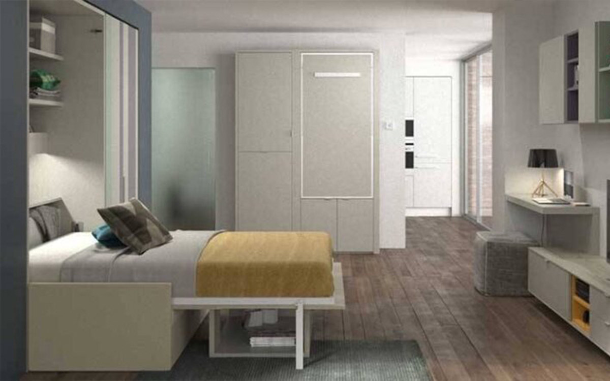 Cama abatible con sofá delantero y arcón de gran capacidad para espacios reducidos.