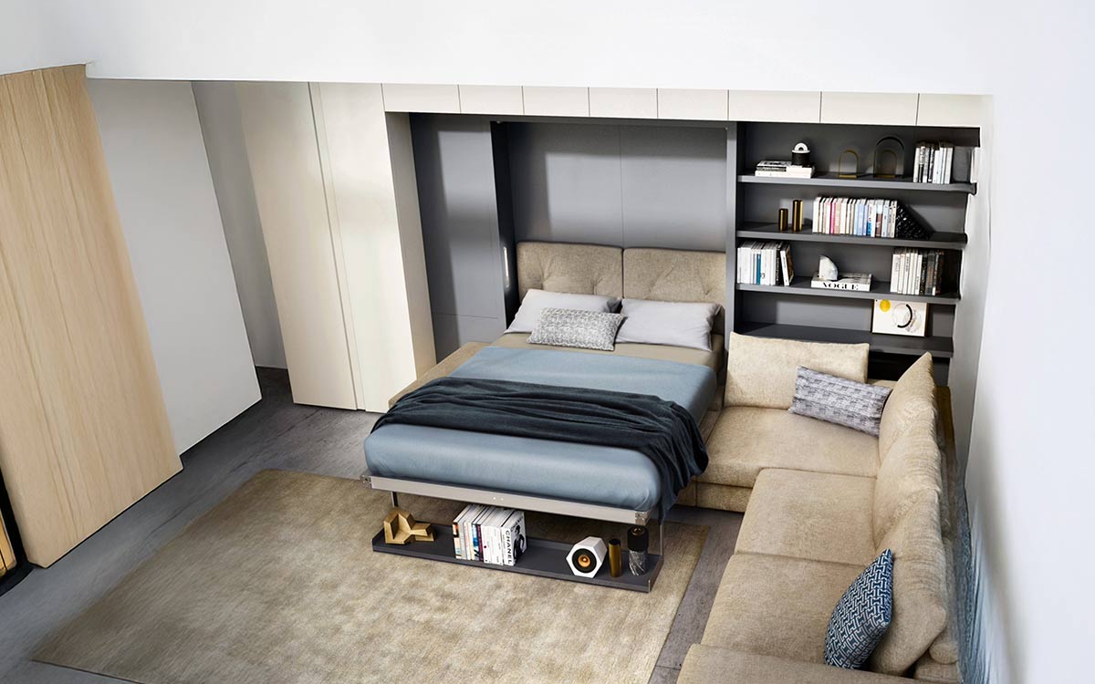 Mueble cama abatible autoportante con sofá y estanterías modulares de gran calidad.