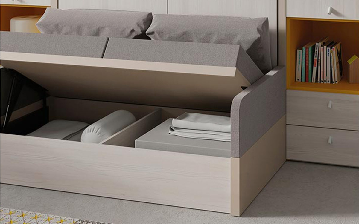 Sofá que se desliza bajo la cama abatible dejando el espacio listo para dormir