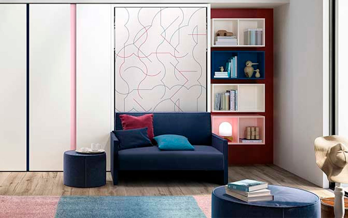 Cama abatible individual autoportante con sofá de espuma desenfundable y librería oculta integrada.