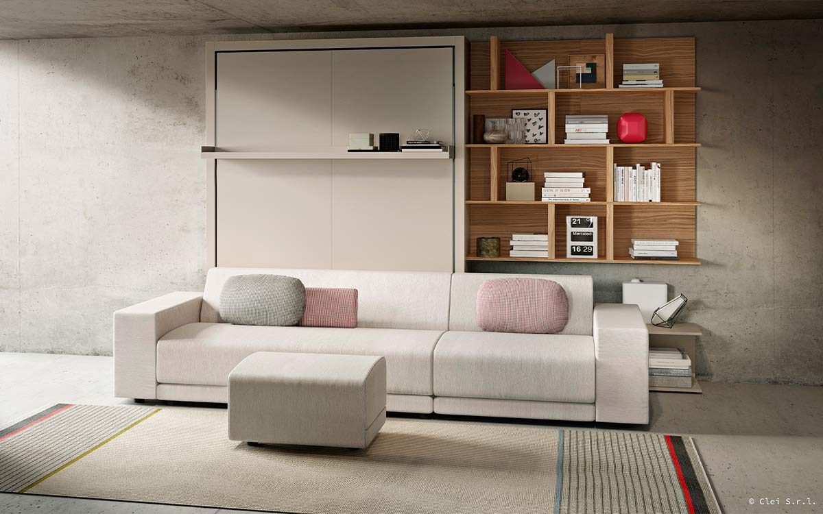 Cama abatible de matrimonio con gran sofá de estilo nórdico desenfundable.