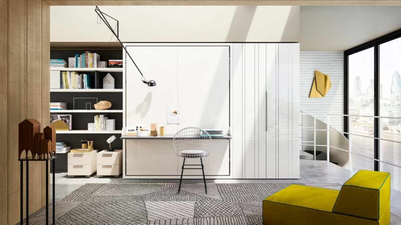 Mueble cama abatible de matrimonio con escritorio pivotante integrado y apertura segura.