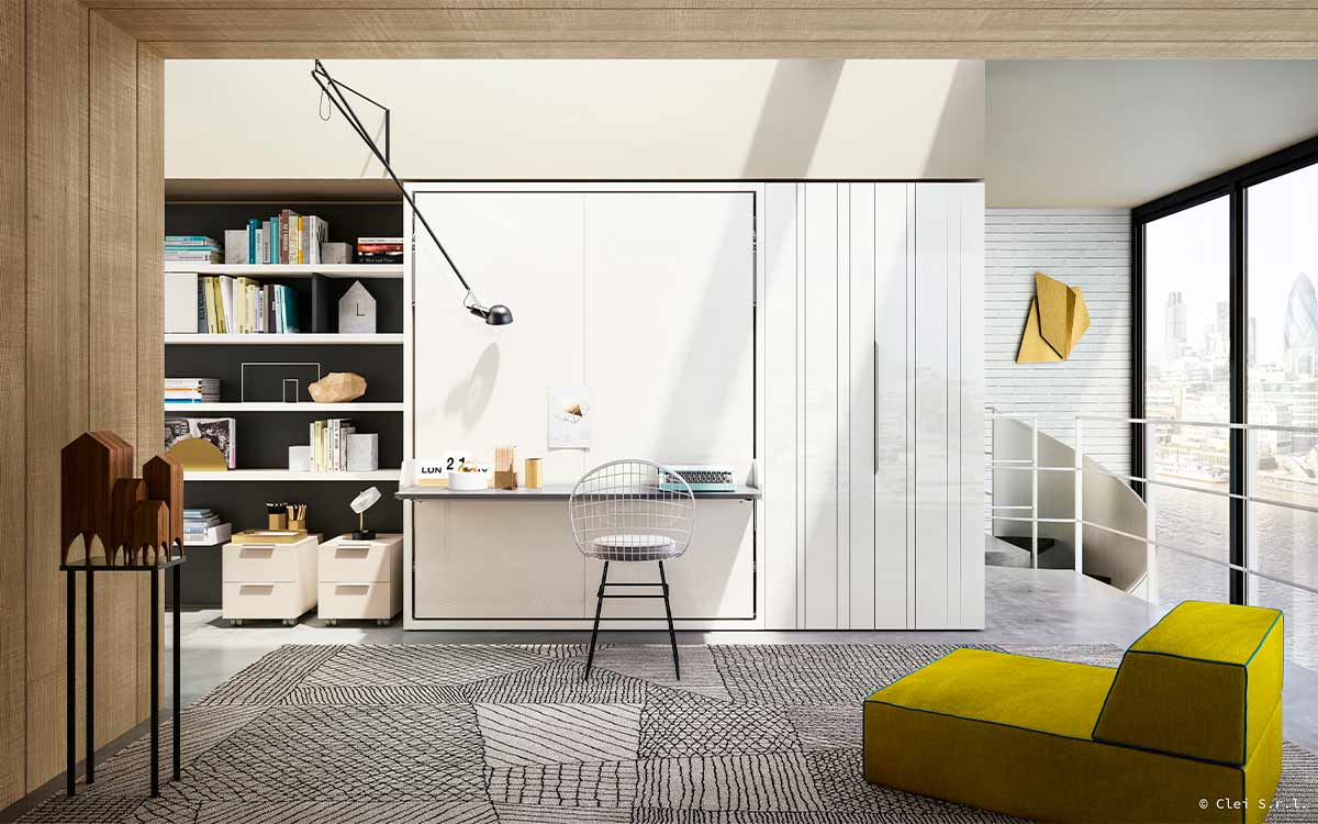 Mueble cama abatible de matrimonio con escritorio pivotante integrado y apertura segura.