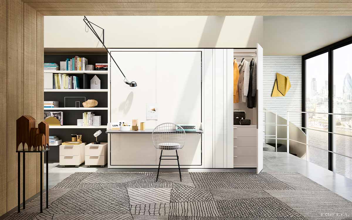 Mueble cama abatible de matrimonio con escritorio pivotante integrado y apertura segura.