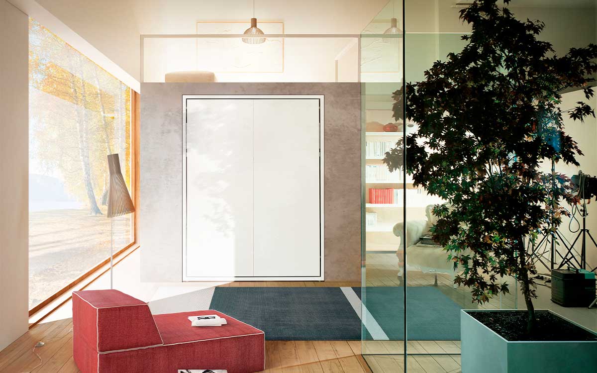 Cama abatible de matrimonio con apertura vertical y somier de láminas patentado.