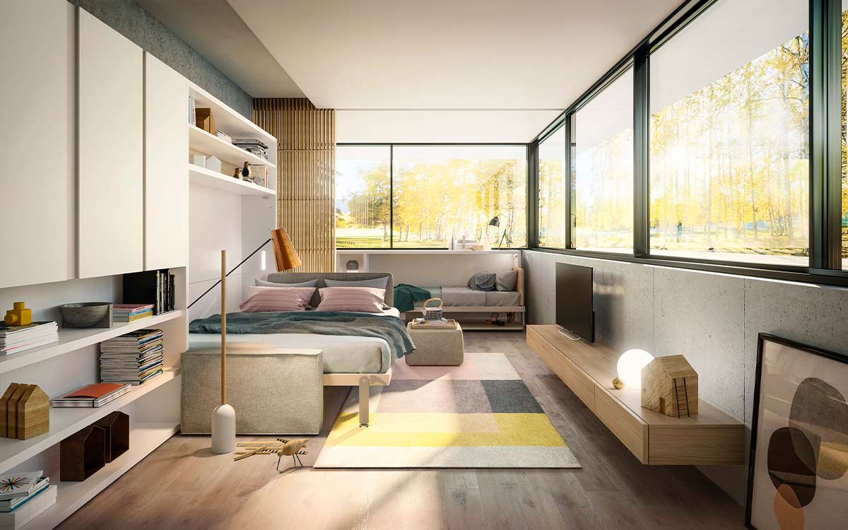 Cama de matrimonio basculante en horizontal con sofá integrado y sistema patentado.