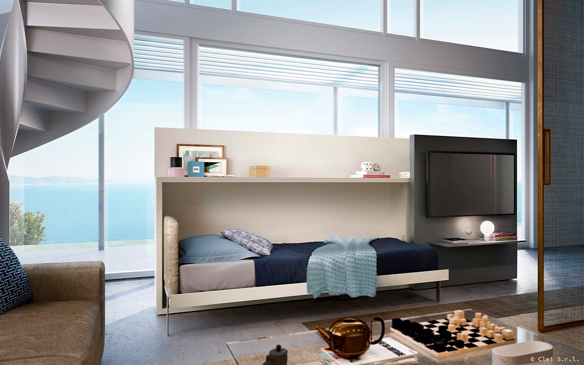 Mueble cama abatible individual con estantería lateral y panel deslizante para TV.