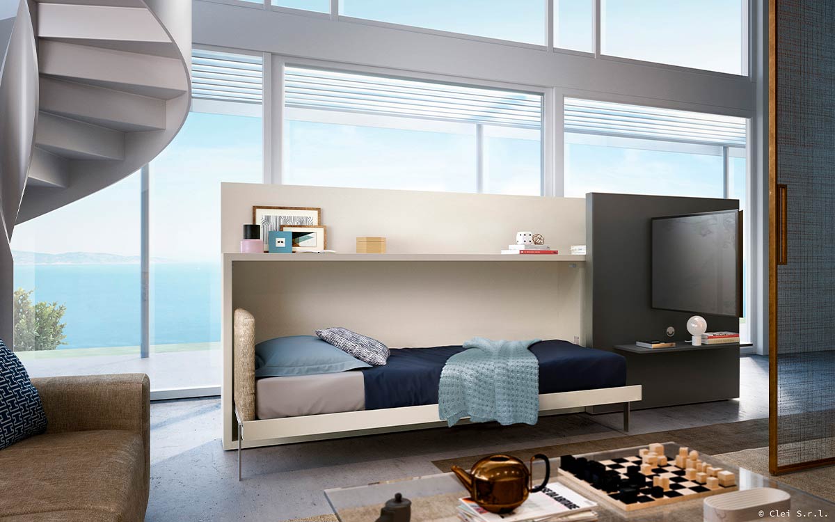 Mueble cama abatible individual con estantería lateral y panel deslizante para TV.