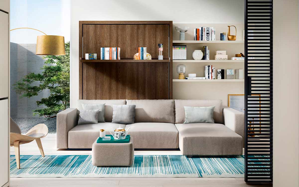 Mueble cama abatible de matrimonio con sofá integrado y asientos extensibles.