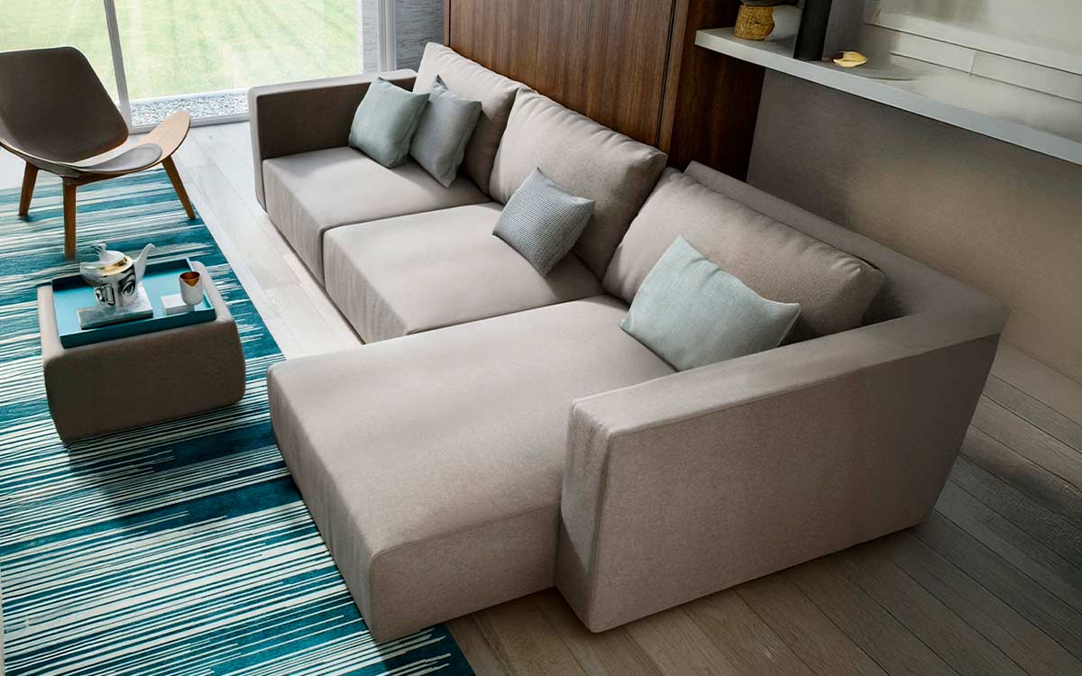 Mueble cama abatible de matrimonio con sofá integrado y asientos extensibles.