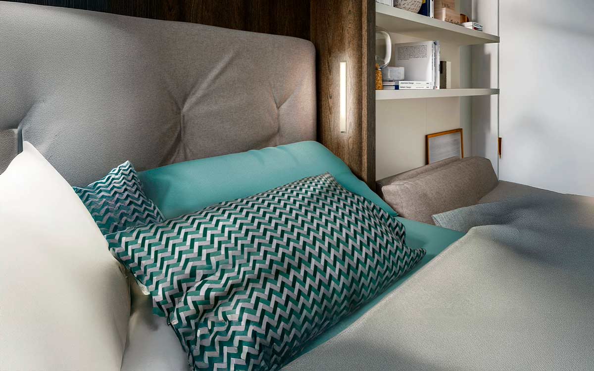 Mueble cama abatible de matrimonio con sofá integrado y asientos extensibles.