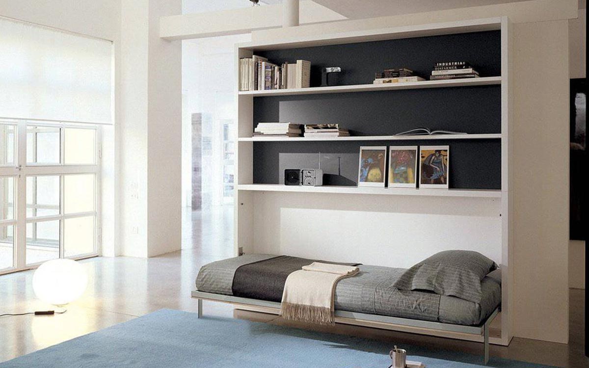 Mueble cama individual abatible con librería superior integrada.