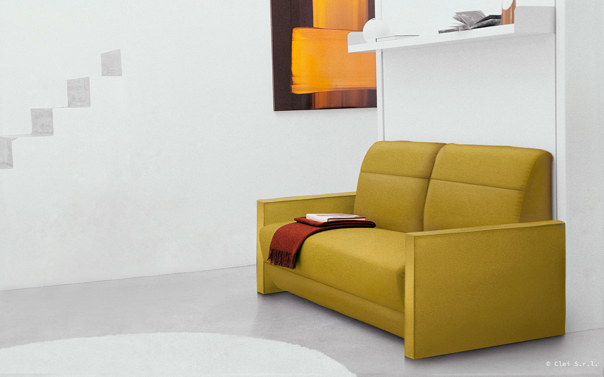 Mueble cama abatible vertical con sofá relax y reposapiés integrado.