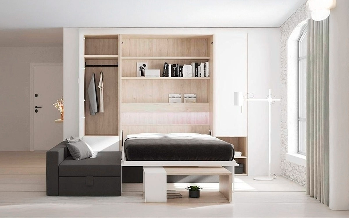 Cama abatible de matrimonio con sofá chaise longue y arcón de gran capacidad.