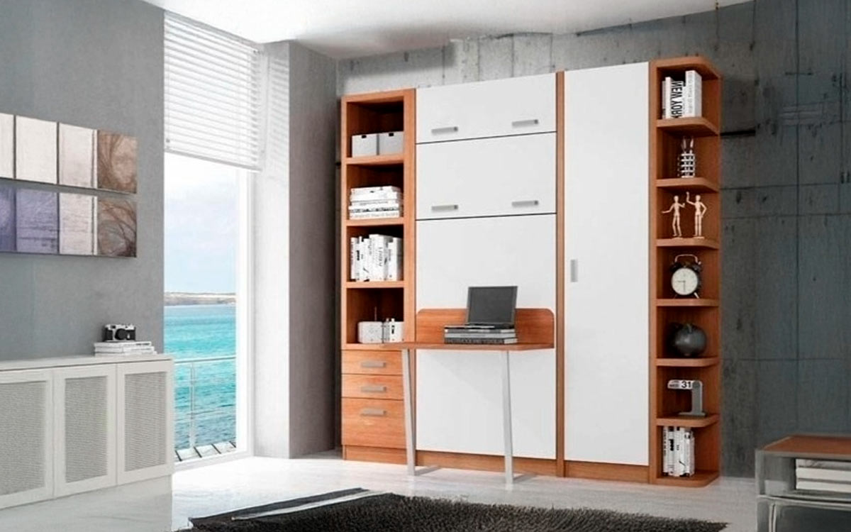 Cama abatible vertical con practica mesa incorporada.